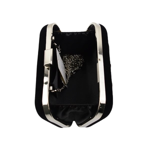 Interior view of black velvet clutch bag with silver chain strap and metal frame