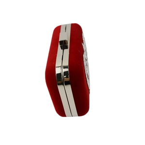 Side view of red velvet evening clutch bag with sparkling rhinestone patterns and silver clasp