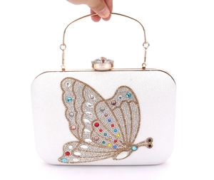Elegant white evening clutch bag with crystal butterfly design and gold metal handle