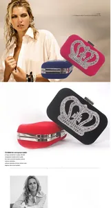 Macro view of crystal crown embellishment on elegant velvet evening clutch bags