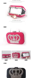 Detail view of crown rhinestone evening bag with chain strap in fuchsia and black