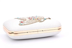 White bridal clutch bag with crystal butterfly ornament and sparkling pearlescent finish