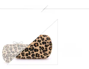 Close-up of leopard print evening clutch with a sparkling rhinestone bow metal clasp