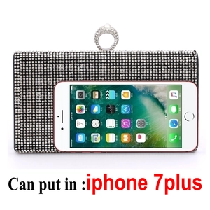 Detail showing internal capacity of rhinestone clutch fitting a large smartphone