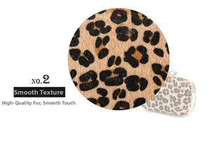 Detailed view of the leopard print faux fur material with a smooth and soft texture