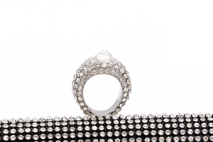 Close-up of sparkling rhinestone evening clutch with crystal-encrusted ring handle