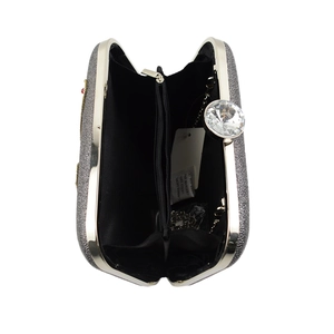 Silver sequin evening clutch bag showing internal black lining and metal chain strap
