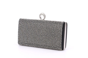 Detail view of rhinestone-encrusted rectangular clutch with ring-top clasp and silver frame
