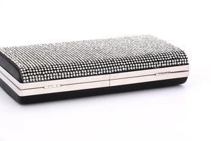 Detail of silver rhinestone embellishment and metal frame on rectangular evening clutch bag