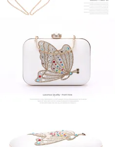 Detail of evening clutch featuring crystal butterfly embroidery and gold metal handle