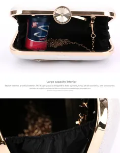 Detail of glitter evening clutch with crystal lock and golden chain interior