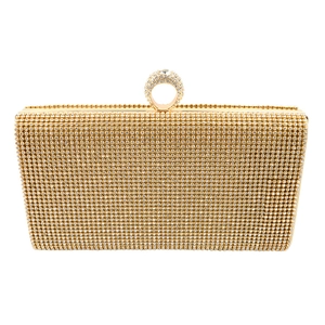 Detail of gold mermaid evening clutch featuring pavé rhinestones and ring handle closure