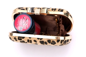 Leopard print plush evening clutch bag with sparkling diamond bow clasp and gold chain