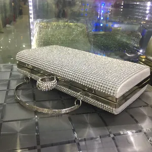 Detailed view of silver mermaid diamond evening clutch with rhinestone ring clasp