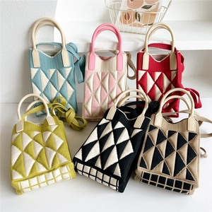 Knitted geometric crossbody bags with silicone handles shown in six vibrant colorways