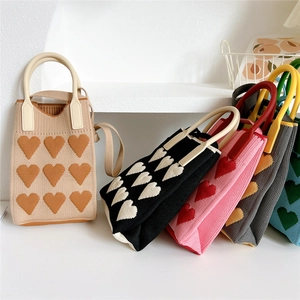 Mini heart pattern knitted crossbody bag with round handles and shoulder strap