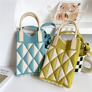 Knitted crossbody bag with geometric diamond pattern and silicone handle in blue and yellow