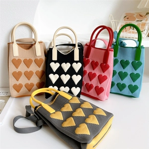 Knitted mini tote bag with 3D heart patterns and soft handles in various colors