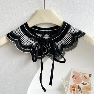 Elegant black and white knit decorative fake collar with ruffled edges and ribbon tie