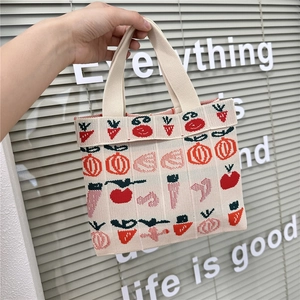 Knitted tote bag with fruit and vegetable patterns featuring magnetic buckle closure