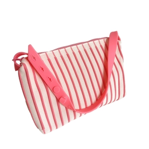 Pink and white striped knit crossbody bag with adjustable silicone shoulder strap