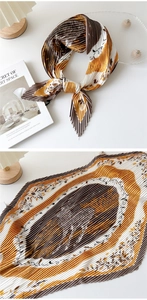 Macro detail of pleated silk scarf featuring vintage horse print and fine texture