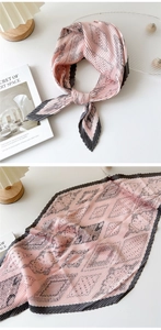 Detail of pink pleated paisley silk scarf with elegant geometric patterns and texture