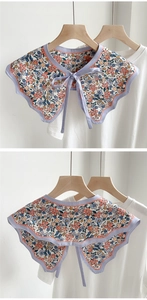 Detail of floral printed decorative collar with ruffled edges and thin tie closure