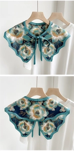 Detail of vintage floral print decorative collar with neck tie and teal golden pattern