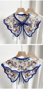 Detail of vintage floral print detachable collar with a navy blue bow and piping