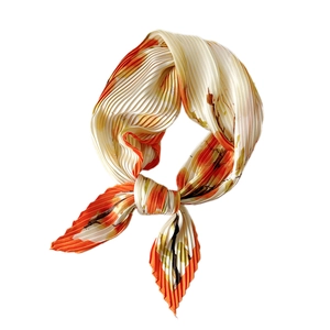 Pleated silk scarf with orange and floral pattern for professional women styling