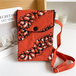 Mini leopard print knitted crossbody phone bag with orange strap and button flap
