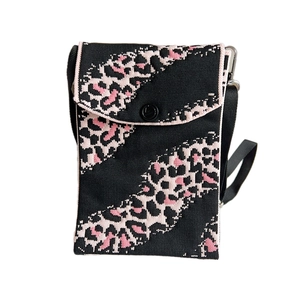 Mini leopard print knitted crossbody phone bag with pink patterns and black button
