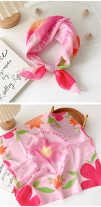 Close-up of pink floral square scarf with you are doing great inspirational text