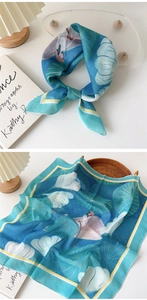 Detail of blue cotton linen scarf featuring lotus patterns and elegant figure illustration