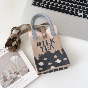 Close-up of knit crossbody phone bag featuring Milk Tea pattern and jacquard texture