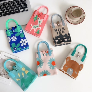 Casual knitted phone bags with cartoon patterns, colorful handles, and button closure
