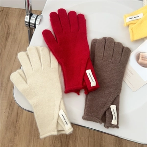 Cozy solid color knitted wool gloves with Jennie Wool label in multiple autumn colors