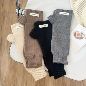 Thick knitted fingerless wool gloves for women in beige brown black and grey colors