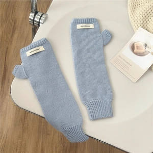 Detailed knit ribbing and branded label on light blue thick warm arm warmer gloves