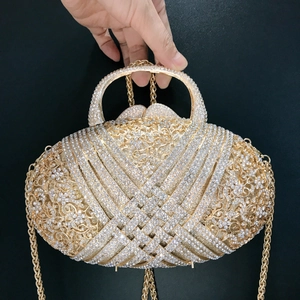 Oval gold rhinestone clutch evening bag with hollow woven pattern and top handle