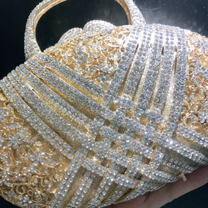 Luxurious gold evening clutch bag with sparkling rhinestones and hollow-out floral patterns