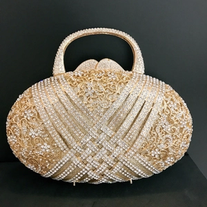 Elegant gold metal evening clutch with shimmering rhinestones and top handle for weddings