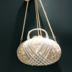 Exquisite hollow out gold dinner clutch bag with white rhinestones and metal chain strap