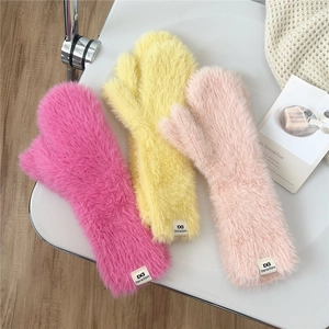 Thick plush winter mittens in rose, yellow and pink colors with soft faux fur texture