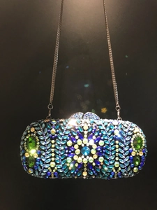 Luxury rhinestone clutch bag with peacock blue floral crystals and silver chain strap