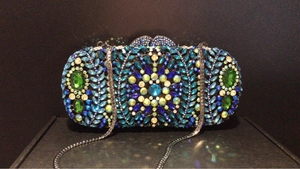Luxury mermaid style clutch bag with multi-colored crystals and silver chain strap
