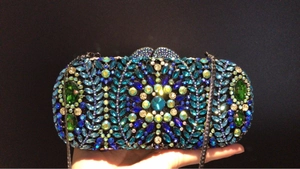 Elegant capsule evening clutch bag featuring radiant emerald and blue crystal embroidery