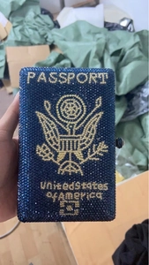 Dark blue passport shaped rhinestone evening clutch bag with gold eagle emblem