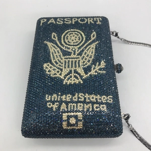 Dark blue passport shaped rhinestone clutch bag with a silver chain for evening events
